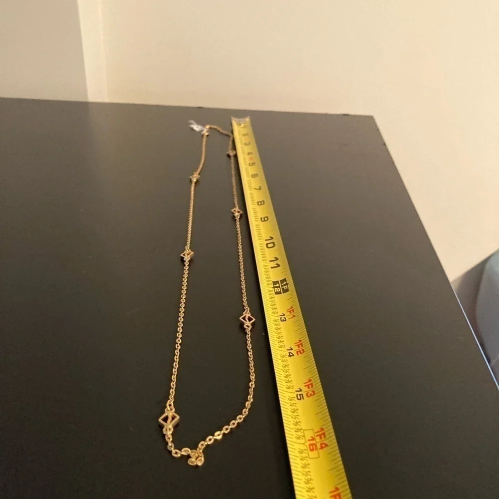 Golden necklace 16” has pretty dainty details.